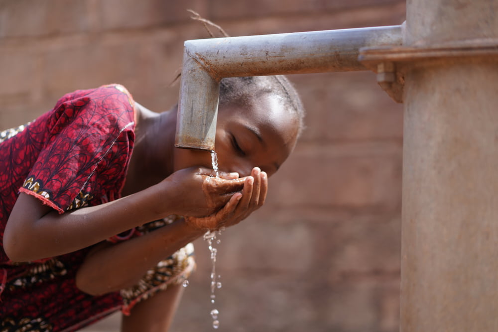 couple,of,black,african,children,drinking,water,from,tap,,human