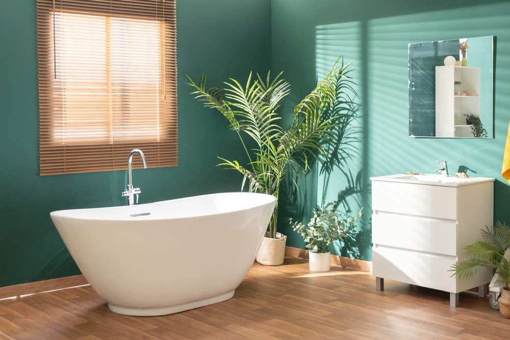 modern,bright,bathroom,with,green,walls,,wooden,floor,,plant,and