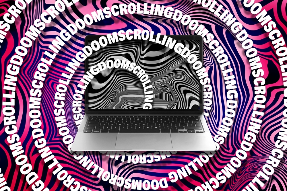 doomscrolling,concept.,words,swirling,out,from,laptop,on,bright,background