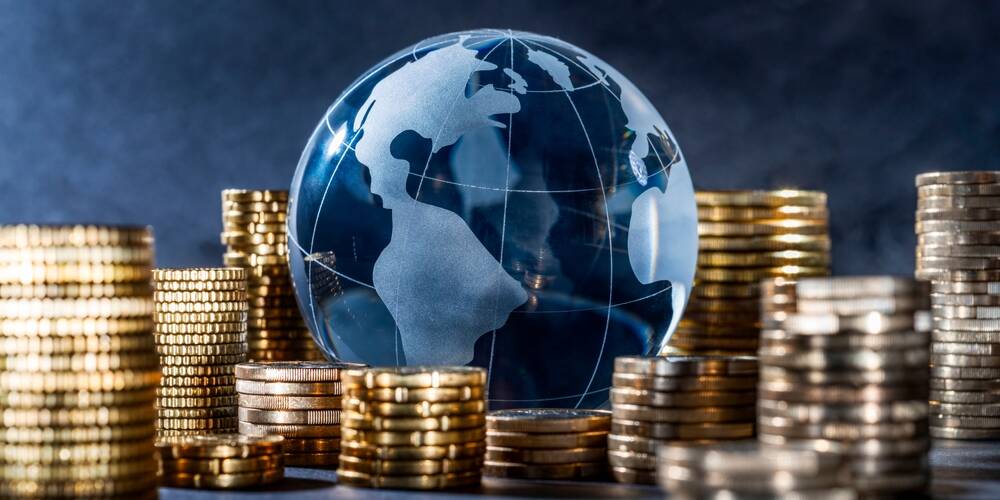 globe,and,stack,with,coins.,money,makes,the,world,go