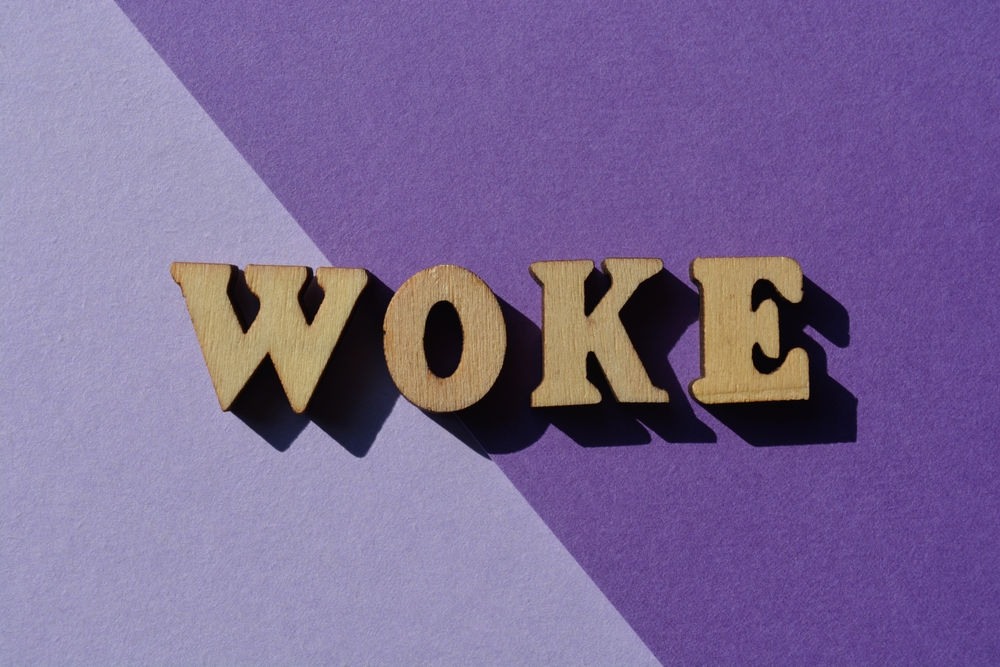 woke,,word,in,wooden,alphabet,letters,isolted,on,purple,background