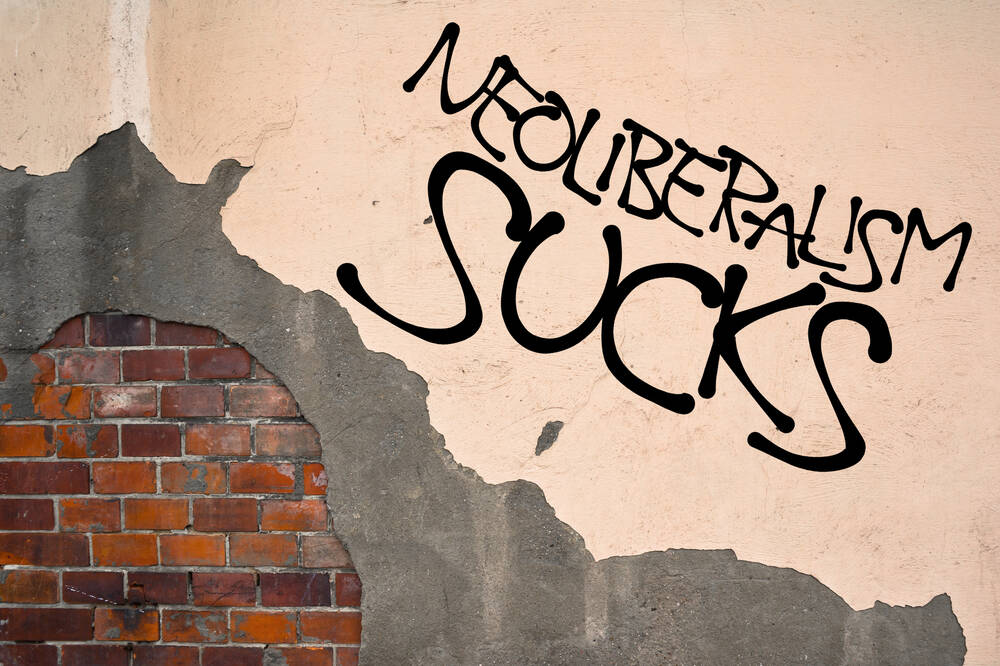 handwritten,graffiti,neoliberalism,sucks,sprayed,on,wall,,anarchist,aesthetics.,appeal