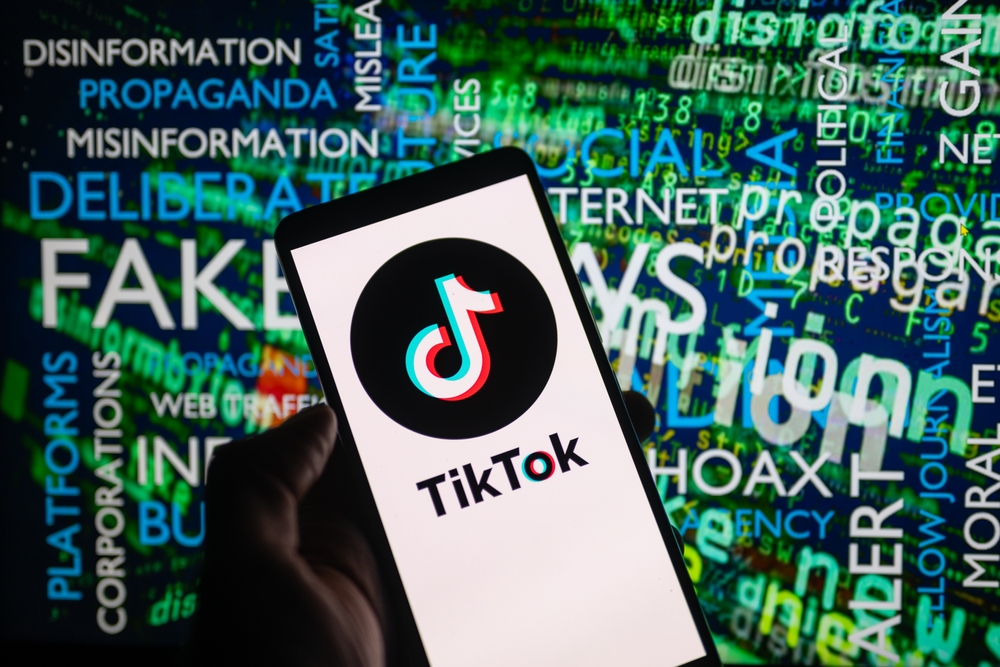 tiktok,icon,logo,displayed,on,a,smartphone,with,disinformation,on
