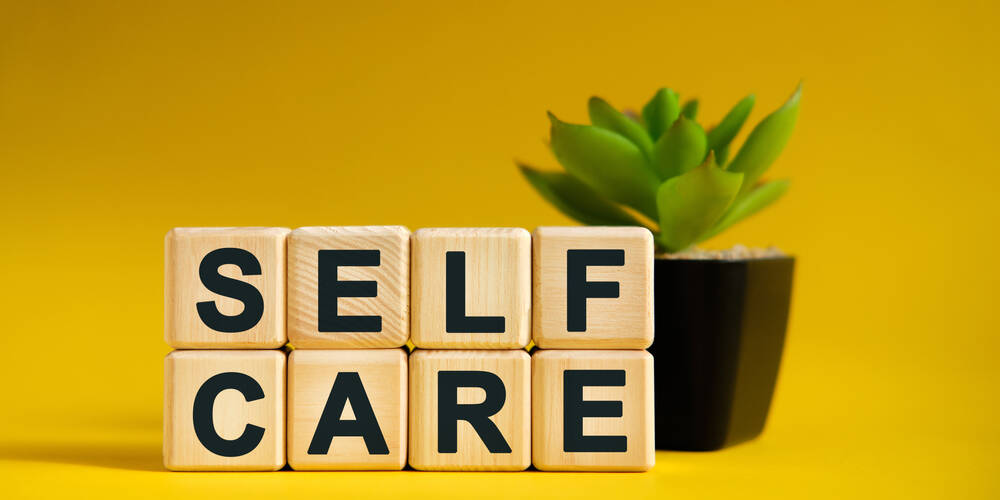 self,care, ,text,on,wooden,cubes,,green,plant,in