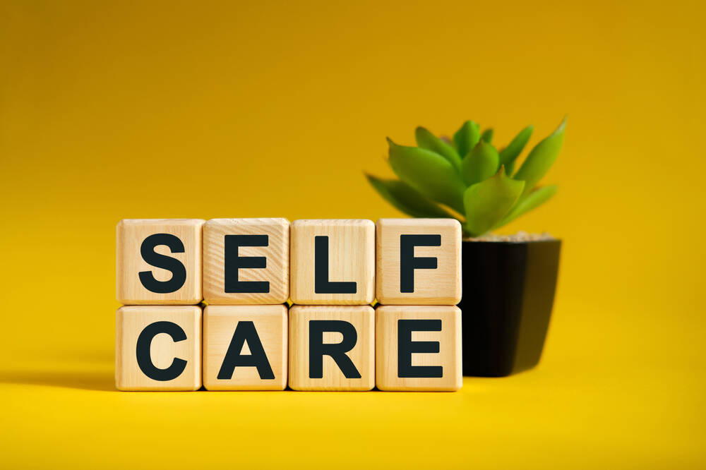 self,care, ,text,on,wooden,cubes,,green,plant,in