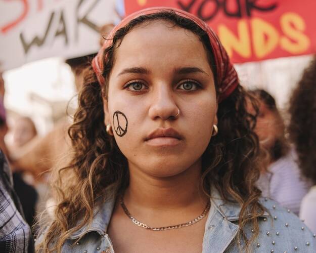 marching,for,world,peace.,young,teenager,looking,at,the,camera