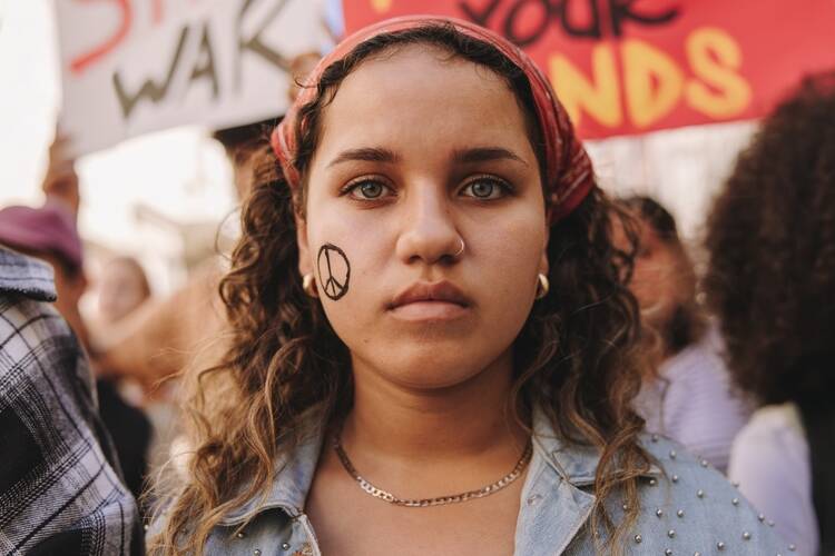 marching,for,world,peace.,young,teenager,looking,at,the,camera