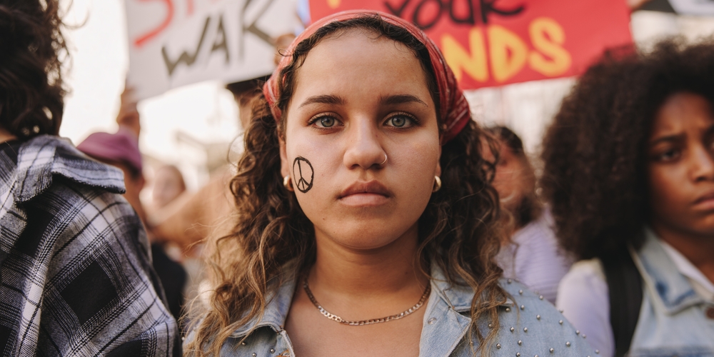 marching,for,world,peace.,young,teenager,looking,at,the,camera