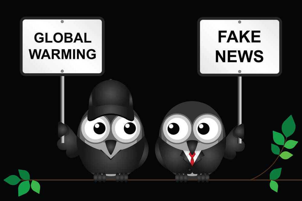 protestor,demonstrating,against,global,warming,and,a,fake,news,denialist