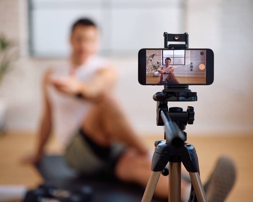 close,up,of,personal,trainer,broadcasting,online,his,exercise,class