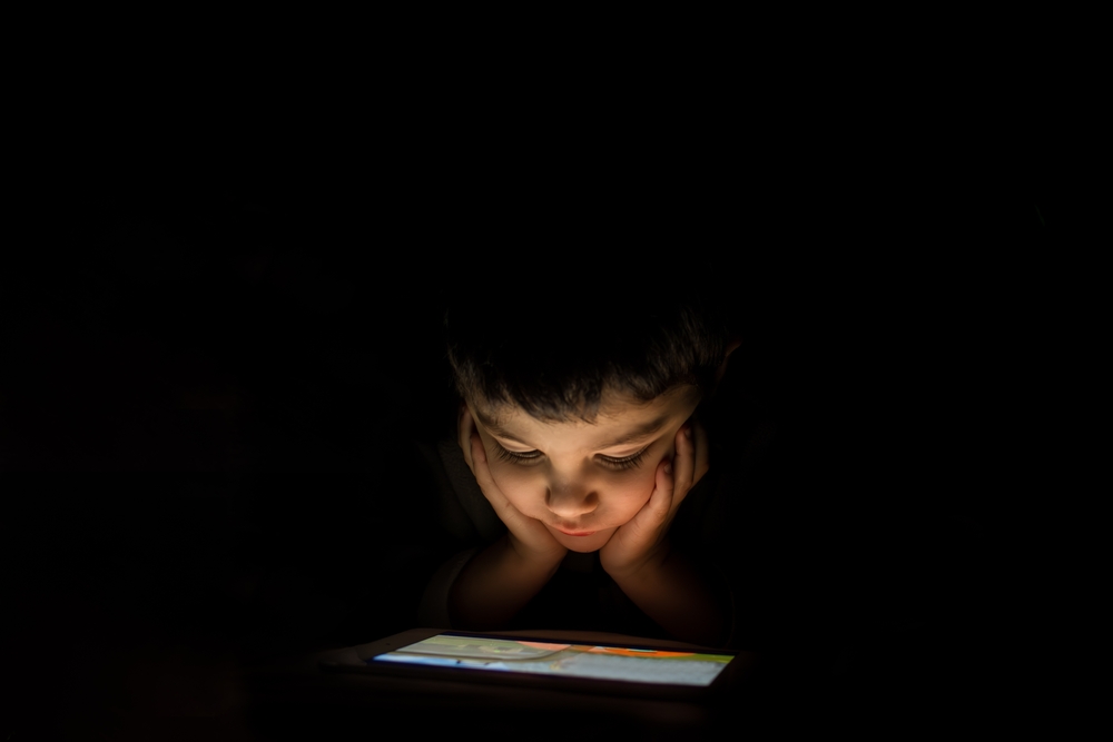 engrossed,boy,enjoys,a,show,on,his,ipad.